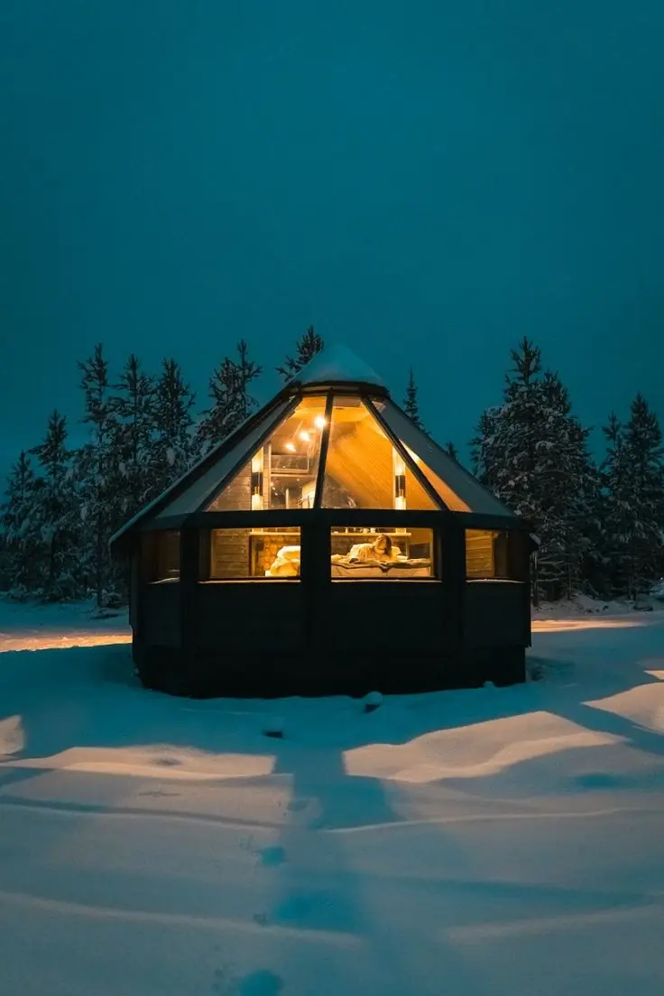 glass-roofed cabins at the Aurora Village Ivalo resort in Finnish Lapland. 